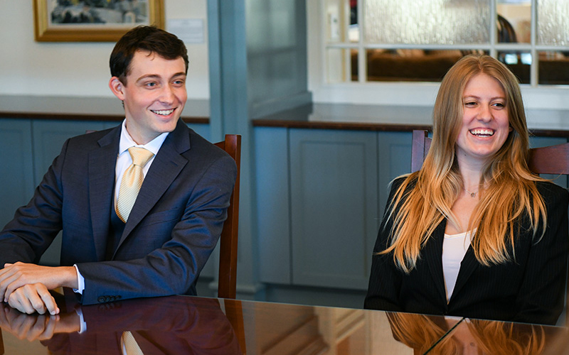 Students at a conference table.