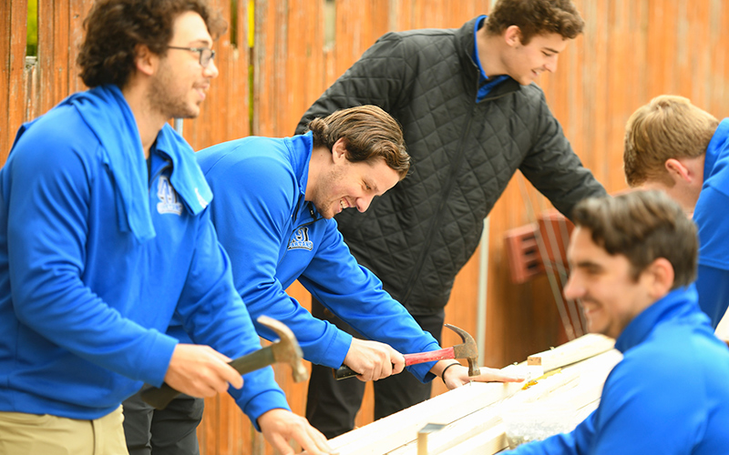 students working together on a service project in the community