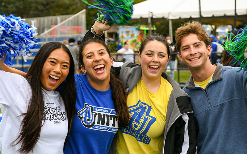 smiling AU students at an outdoor event